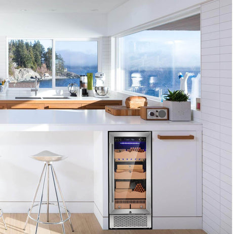 Antarctic Star wine cooler in a mostly white kitchen overlooking the ocean with big windows.