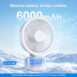 A small white portable fan with a clear battery base stands in snow, with promotional text reading 'Massive battery all-day runtime. 6000mAh' and 'Built-in 6000 mAh battery provides 2.